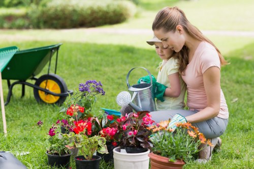 Professional landscaper designing a vibrant garden in Kentish Town